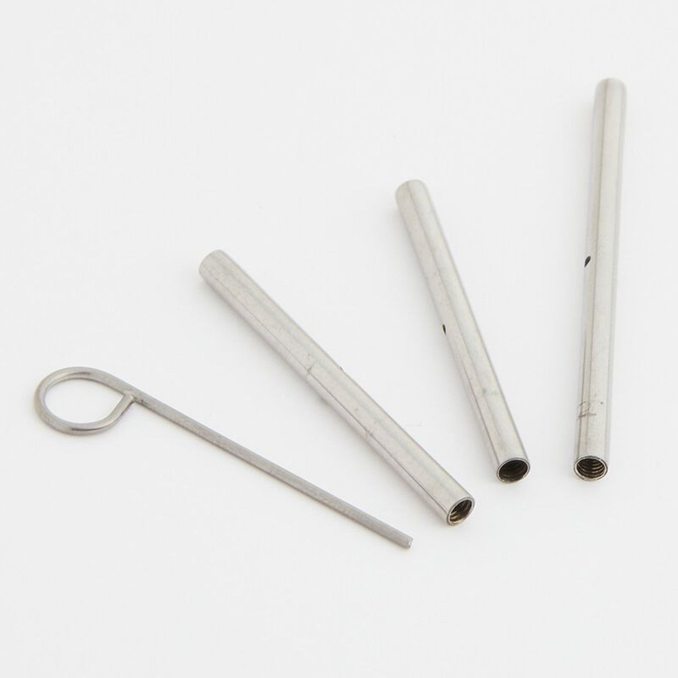 Bild vom Packungsinhalt. 3 Seilverbinder und Seilschlüssel aus Metall