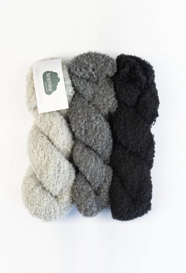 Drei Stränge Alpaca Bouclé hellgrau, grau, schwarz