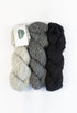 Drei Stränge Alpaca Bouclé hellgrau, grau, schwarz